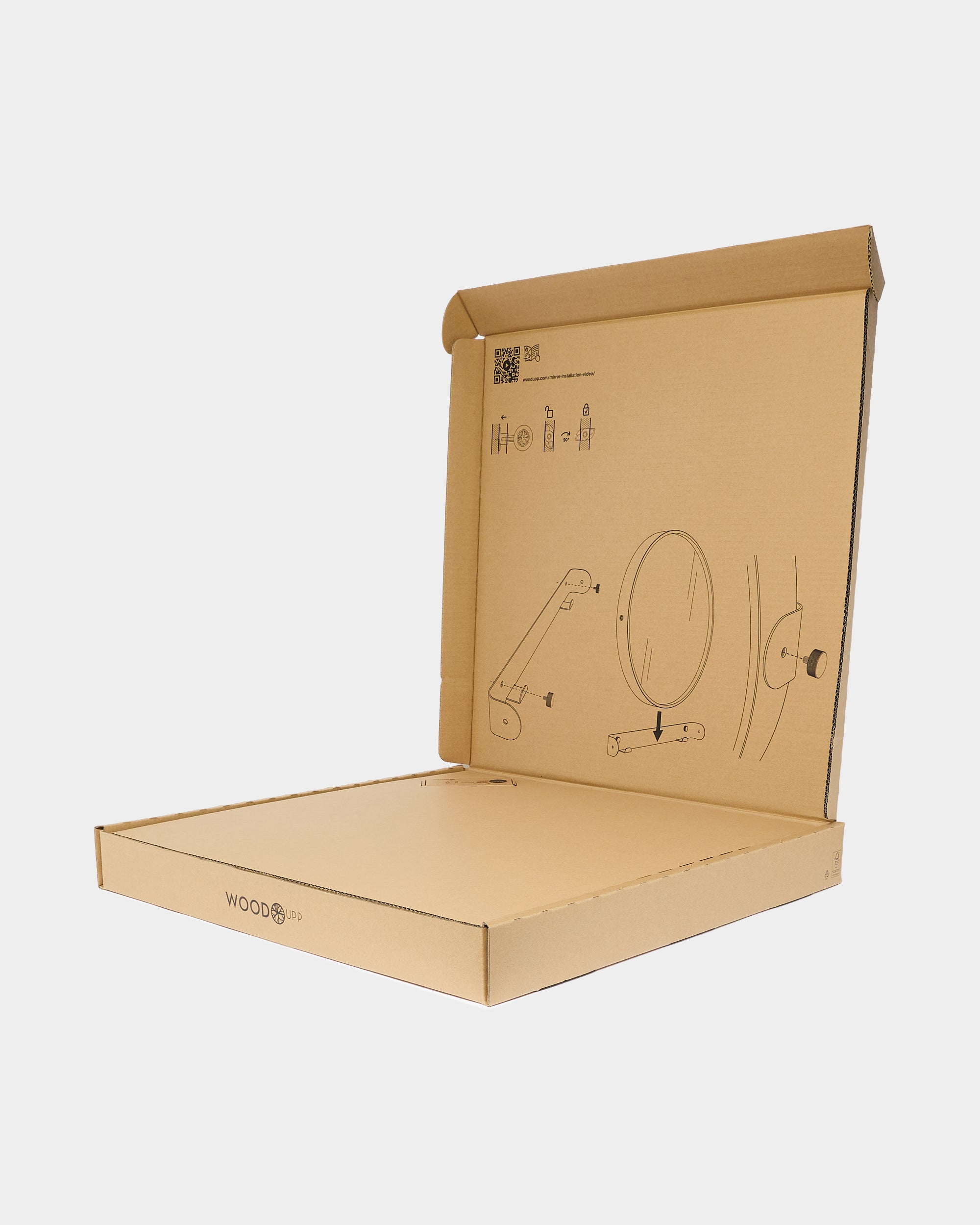 Open cardboard box with assembly instructions for acoustic panel installation printed inside the lid, designed for efficient packaging and easy setup.